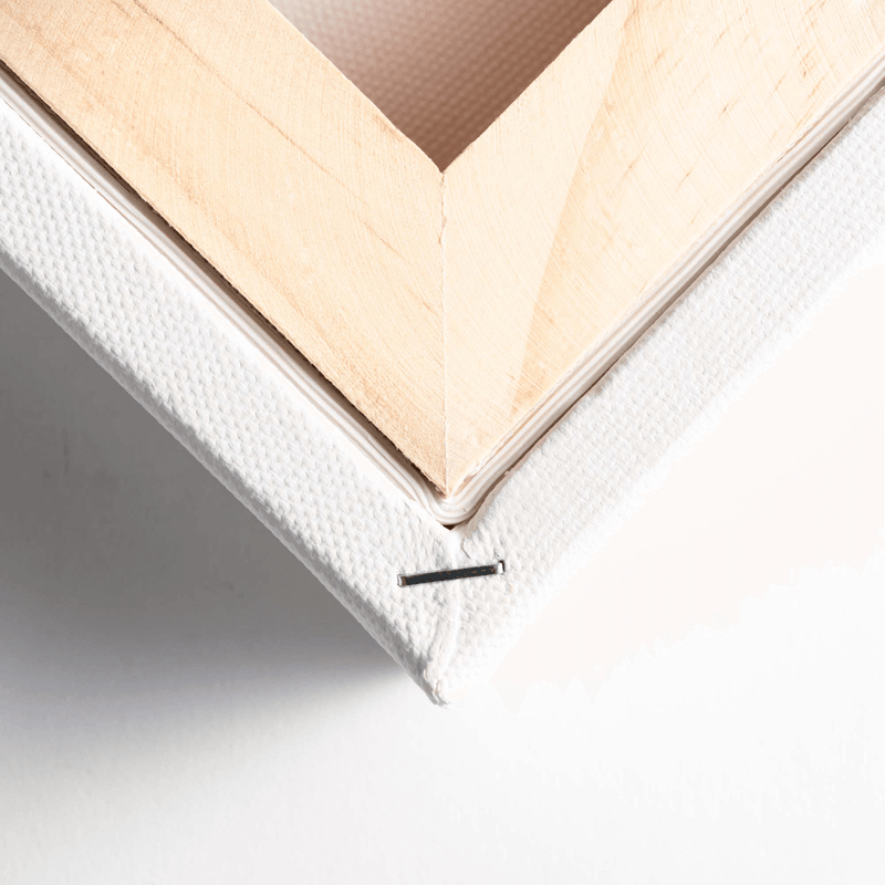 Close up of the corner of the back of the canvas, showing the wooden frame of a Loxley Gold Chunky Canvas that measures 14 by 14 inches and comes in a box of 5.