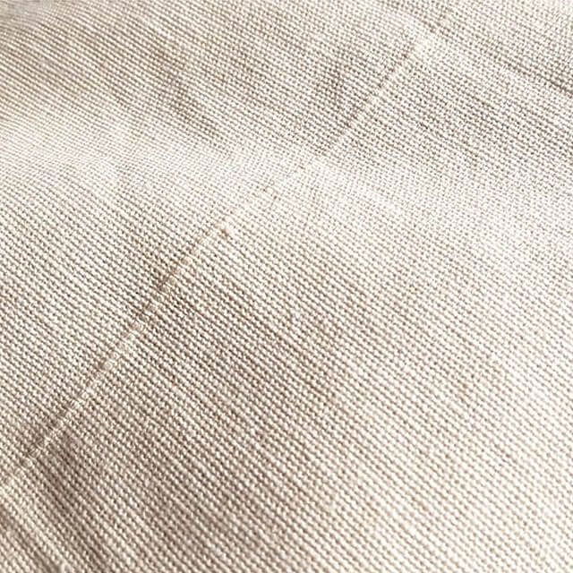 Close up image of the texture of a Loxley Cotton Canvas Roll that is Unprimed made from Cotton and is 1 by 10 metres and weighs 5 oz