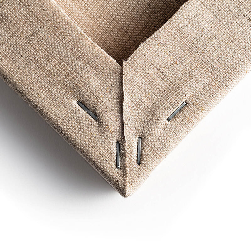 Close up of corner of a Loxley Linen Clear Gesso Canvas that is 20 by 16 inches and comes in a box of 5